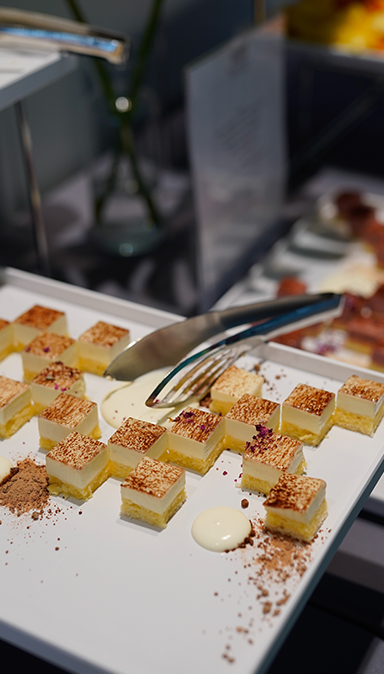 Black and white photo of a women performing modern dance on a dark background.