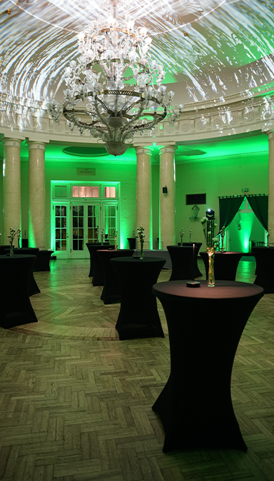 Black and white photo of a women performing modern dance on a dark background.