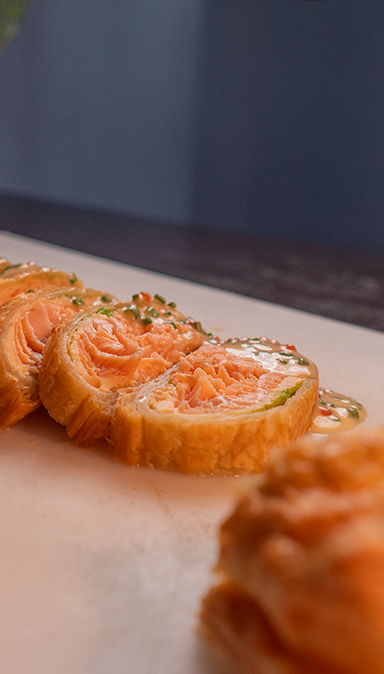 Black and white photo of a women performing modern dance on a dark background.