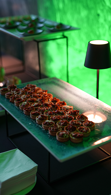 Black and white photo of a women performing modern dance on a dark background.