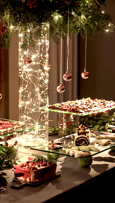 Black and white photo of a women performing modern dance on a dark background.