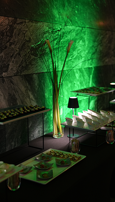 Black and white photo of a women performing modern dance on a dark background.