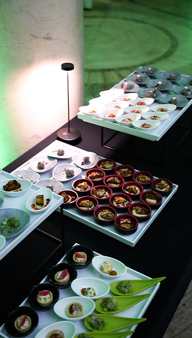 Black and white photo of a women performing modern dance on a dark background.