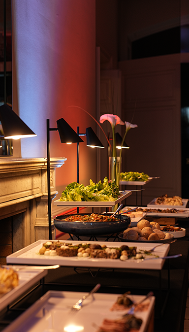 Black and white photo of a women performing modern dance on a dark background.