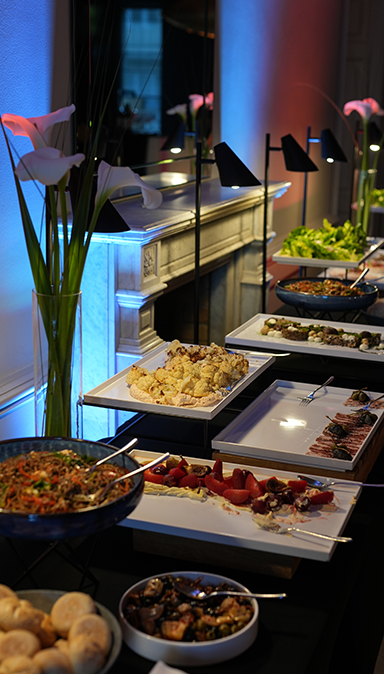 Black and white photo of a women performing modern dance on a dark background.