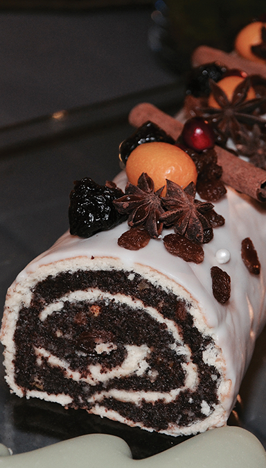 Black and white photo of a women performing modern dance on a dark background.
