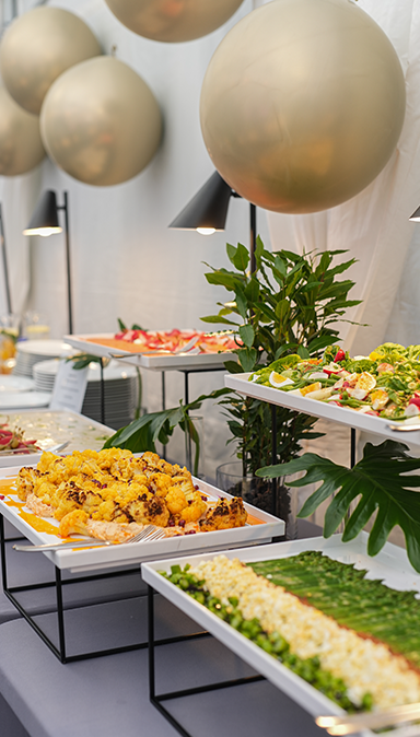 Black and white photo of a women performing modern dance on a dark background.