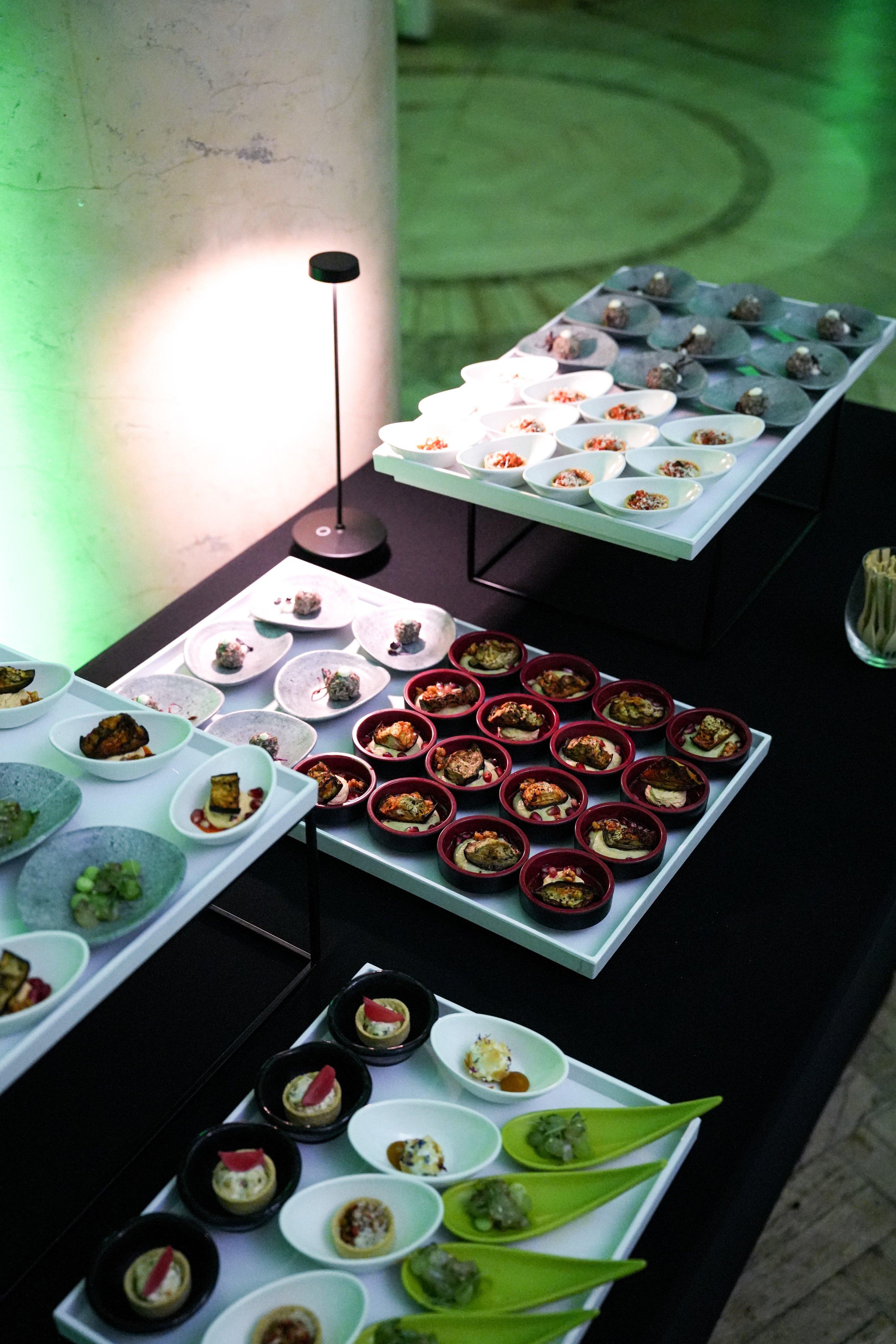 Black and white photo of a women performing modern dance on a dark background.