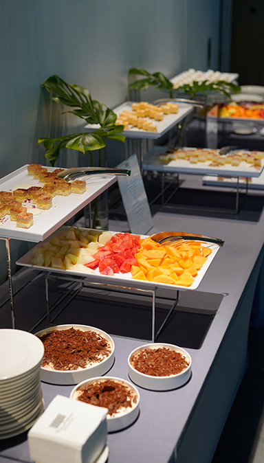 Black and white photo of a women performing modern dance on a dark background.