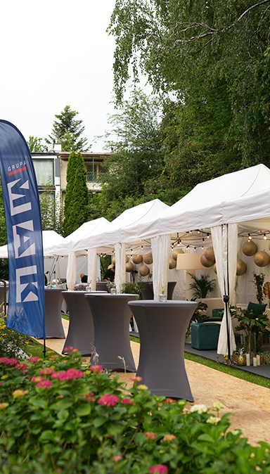 Black and white photo of a women performing modern dance on a dark background.