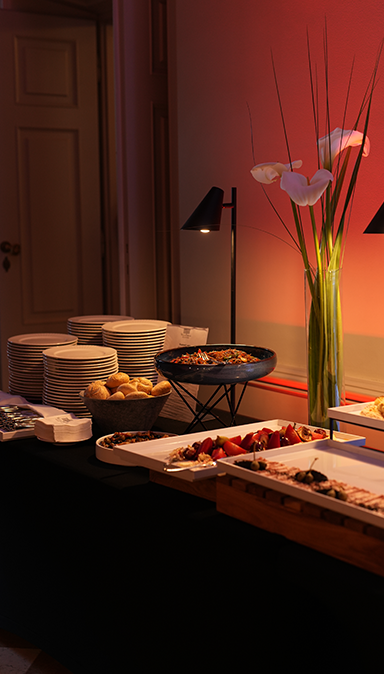 Black and white photo of a women performing modern dance on a dark background.